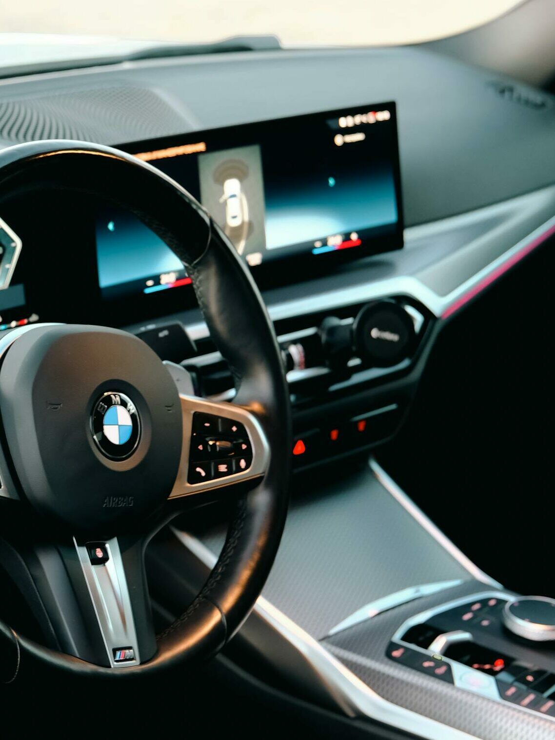 Sleek car interior showcasing advanced dashboard displays and ergonomic design.