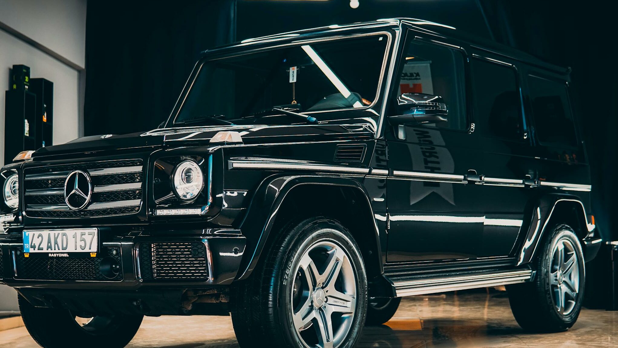 Elegant black Mercedes SUV showcased in a modern indoor setting.